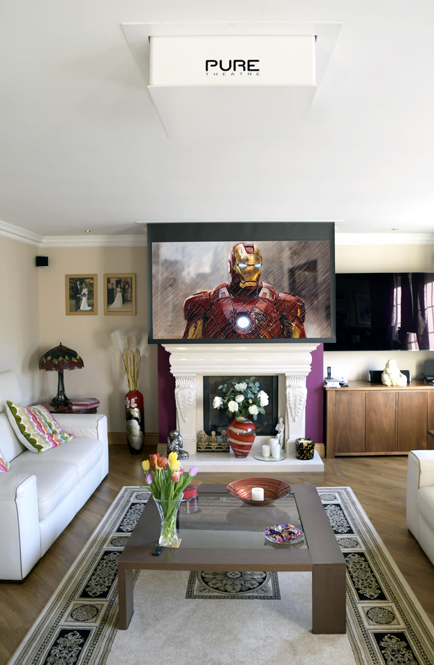 Busy living room with projector screen infront of fireplace