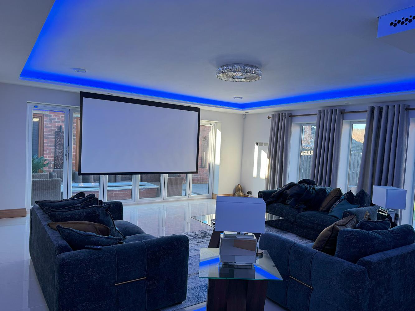 Projector screen in front of bifold doors