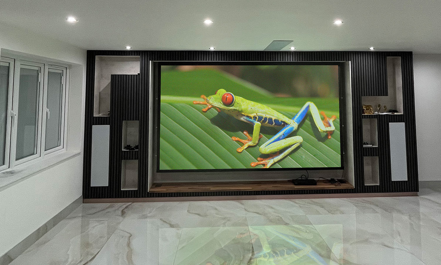 Media wall with large projector screen