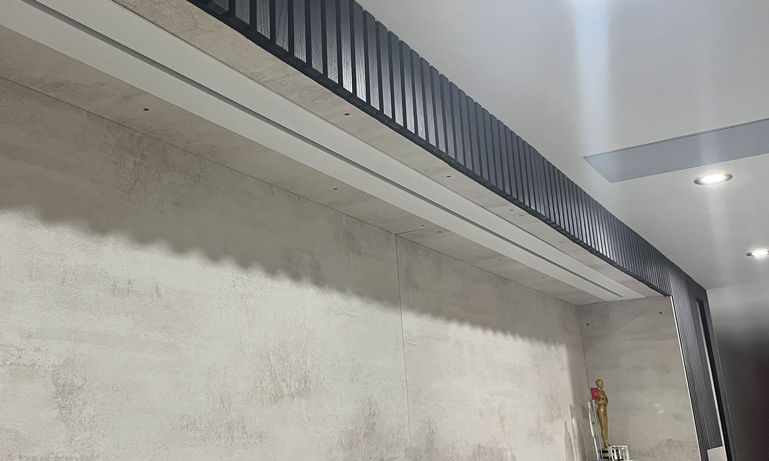 Projector screen built into media wall