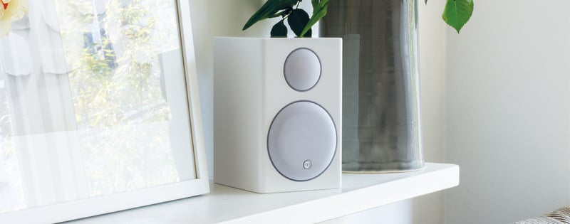 Monitor Audio Radius 90 White Bookshelf speaker on a shelf