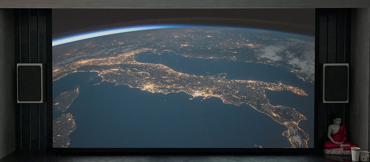 concealed projector screen showing earth