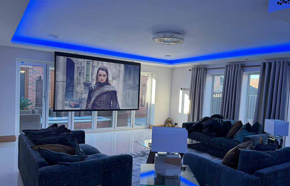 Fully Concealed Home cinema in front of bifold doors complete with invisible speakers