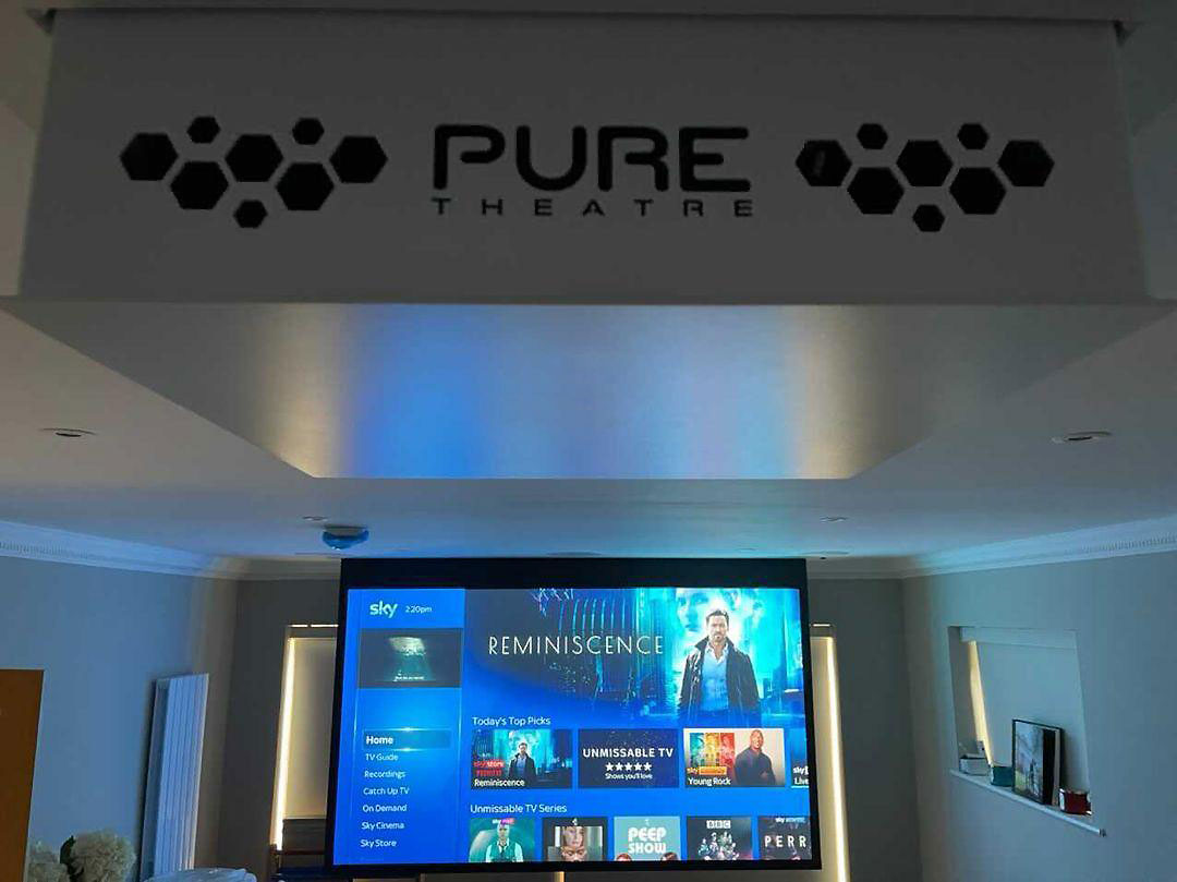 pure theatre projector lift down with projector screen behind with sky showing